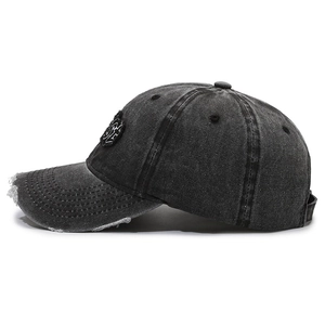 Vintage distressed grey denim baseball cap with frayed edges and embroidered patch