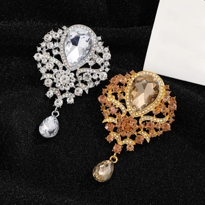Elegant crown brooch with teardrop crystal and rhinestones in gold and silver finish