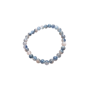 Elegant blue synthetic kyanite beaded bracelet with natural texture on a white background