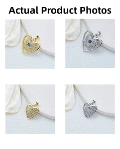Macro shot of gold and silver heart pendants with Evil Eye and Hamsa Hand zircon stones