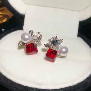 Elegant floral pearl studs with red square crystals and sparkling silver base