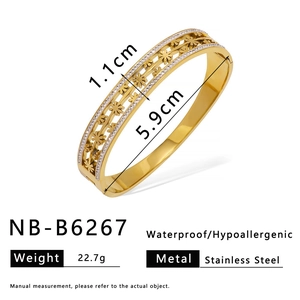 Gold stainless steel hollow cuff bangle with floral patterns and size specifications