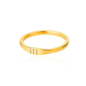 Macro shot of minimalist gold stainless steel ring featuring 111 angel number engraving