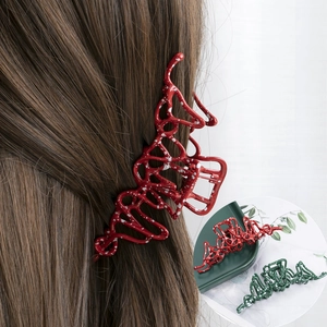 Irregular liquid metal hair claw clip with red and green splatter pattern for women