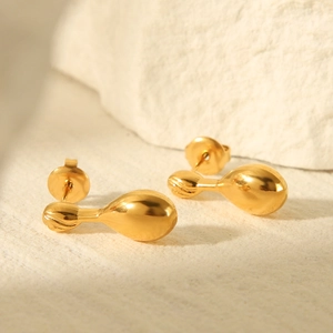 Polished 18k gold plated stainless steel teardrop earrings on a stone surface