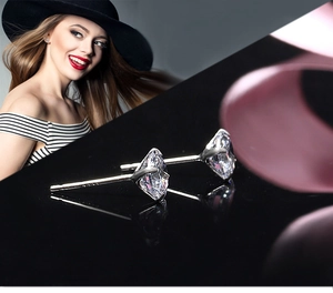 Detailed macro view of S925 sterling silver four-prong stud earring with a 925 hallmark
