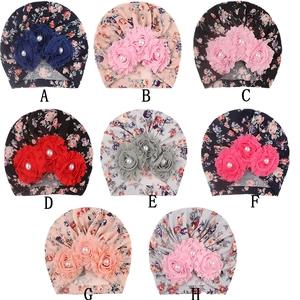 Grid view of soft floral baby hats with 3D fabric flowers and pearl accents