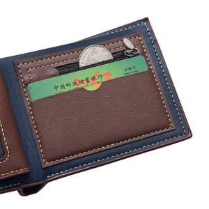 Detail view of brown and blue leather wallet showing multi-card slots and zipper pocket