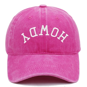 Close-up of Howdy embroidery on washed rose pink cotton vintage baseball cap