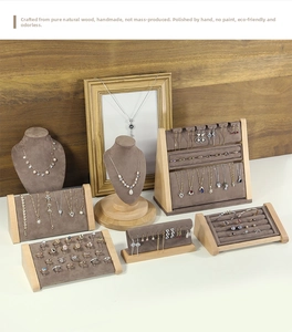 Detailed set of wooden jewelry displays with brown velvet lining for rings and necklaces