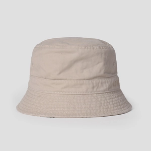 Close-up of beige cotton bucket hat with detailed brim stitching and subtle embroidery