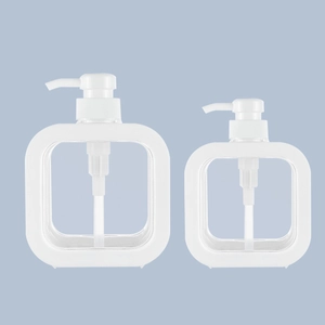 Clear plastic soap dispenser bottles with white pump and frame in two sizes