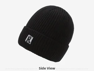 Detailed side view of black ribbed knit beanie with R letter patch embroidery