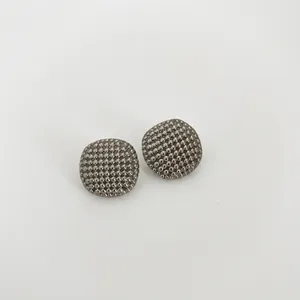 Luxury hollow spherical bead earrings in gold finish with textured industrial punk style