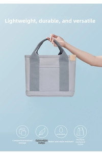 Water-repellent grey canvas tote bag with multi-compartments and lightweight design