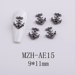 Macro view of gunmetal gothic skull anchor nail charms for dark aesthetic manicures