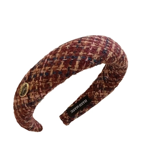 Checkered tweed headband in reddish brown with a gold metal plate and handmade label
