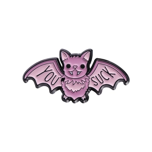 Cute pink bat enamel pin with YOU SUCK lettering and black metal outlines on white background