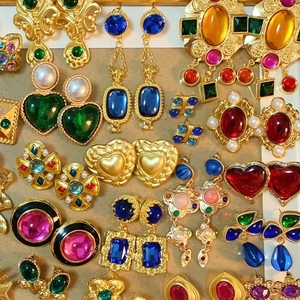 Vintage style gold earrings with colorful gemstones and pearls in various shapes