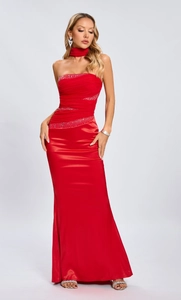 Detail of red strapless evening dress with shimmering rhinestones and silk texture