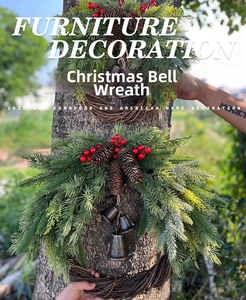 Detail of Christmas bell wreaths with red berries pine cones and rustic greenery