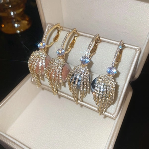 Sparkling tassel hoop earrings with round resin stones and rhinestones in a gift box