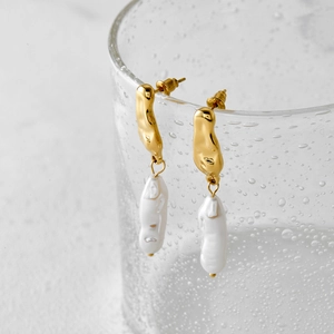 Baroque irregular pearl drop earrings with minimalist gold lava-style stainless steel design