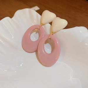 Sweet contrast resin heart and oval earrings on shell tray with silver needle studs