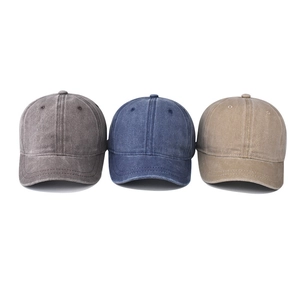 Three washed cotton short brim baseball caps in dark grey, navy blue, and khaki colors