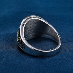 Retro stainless steel scorpion ring with black diamond and gold emblem details