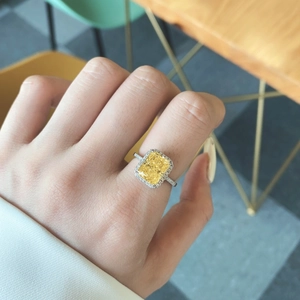 Elegant S925 sterling silver ring with radiant cut yellow gemstone in halo design