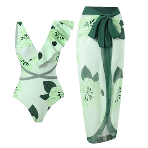 Three-piece floral bikini set featuring a green v-neck swimsuit and matching wrap skirt