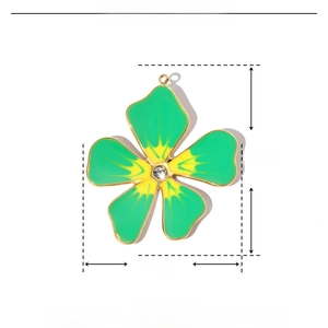 Detailed view of enamel flower pendant with green gradient and central rhinestone