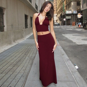 Detailed view of burgundy backless halter top with metal ring and maxi skirt