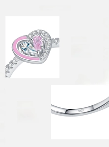 Macro detail of S925 silver ring featuring pink pear zircon and heart shaped crystals