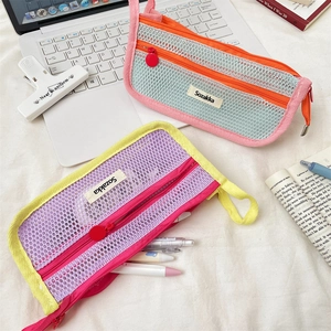 Close-up of high-capacity mesh pencil case with double-layer vibrant contrast color design