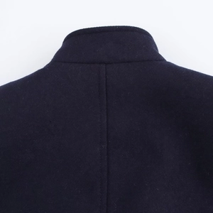 Detail view of the back collar and vertical center seam on this wool blend coat