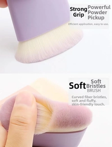 Detail of soft gradient synthetic bristles on a purple makeup brush for powder