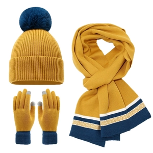Winter knit set with pom-pom beanie, scarf, and touchscreen gloves in ginger yellow