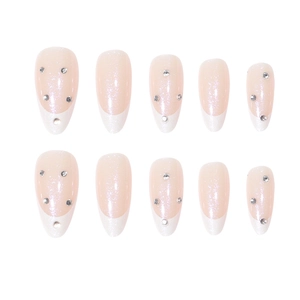Aurora white French tip press-on nails with sparkling rhinestones in almond shape