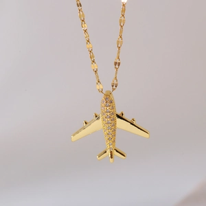 Minimalist gold airplane necklace featuring a sparkling pavé crystal aircraft pendant