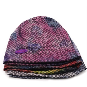 Detail of multi-color breathable mesh beanies with purple rubber logo patch