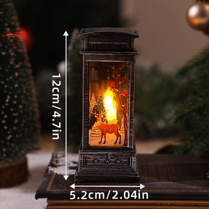 Detail of Christmas lantern with deer scene and warm LED light on vintage books