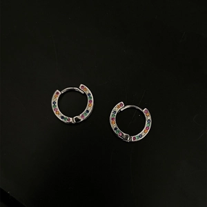 Sleek silver huggie earrings featuring vibrant rainbow cubic zirconia inlay on black base