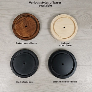 Detailed comparison of four circular display bases in wood, plastic, and lacquer finishes