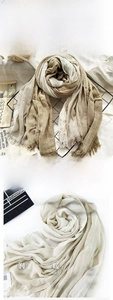 Detailed macro view of khaki striped cotton linen scarf fabric with fringed edges