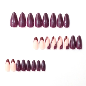 Almond shaped press-on nails set featuring deep purple and pink with gold stripe accents