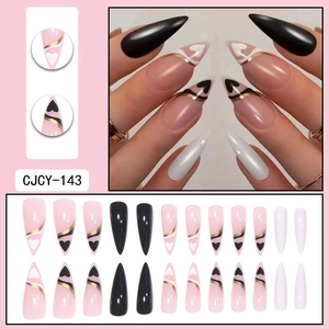 Long stiletto press-on nails in pink and black with heart patterns and gold line accents