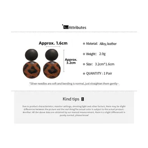 Detail view of leopard print heart earrings with alloy and leather material specifications