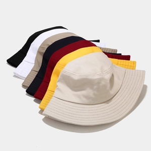 Stack of colorful cotton bucket hats for men and women featuring reinforced stitching